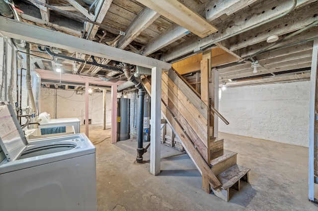 basement featuring washer and dryer and water heater