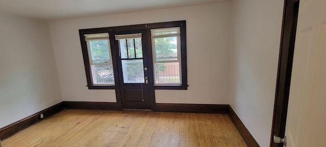 spare room with light hardwood / wood-style floors