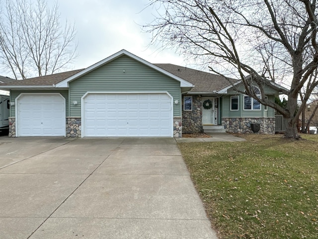 single story home with a garage and a front yard