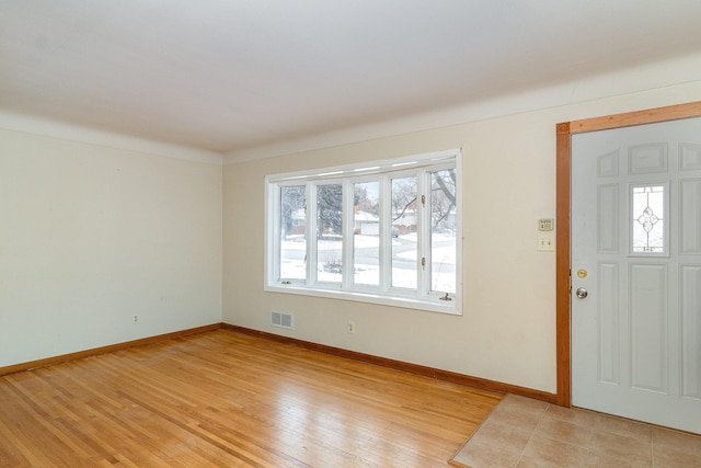 foyer entrance with light hardwood / wood-style flooring