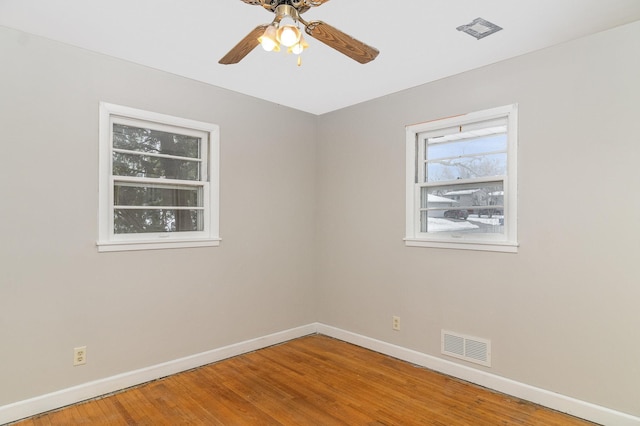 unfurnished room featuring hardwood / wood-style flooring and ceiling fan