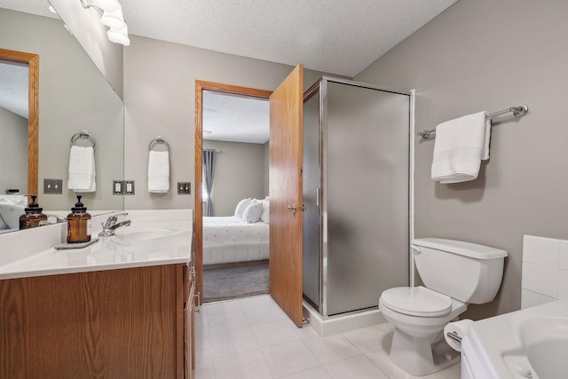 bathroom with vanity, a shower with shower door, a textured ceiling, and toilet