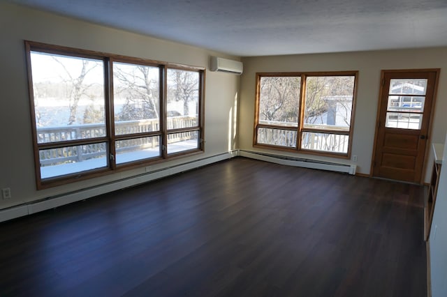 interior space with dark hardwood / wood-style floors, a wall unit AC, a wealth of natural light, and a baseboard radiator