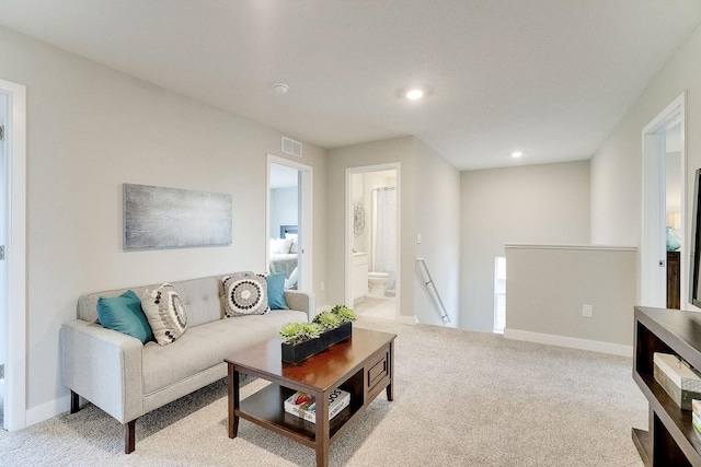 carpeted living room with recessed lighting, visible vents, and baseboards