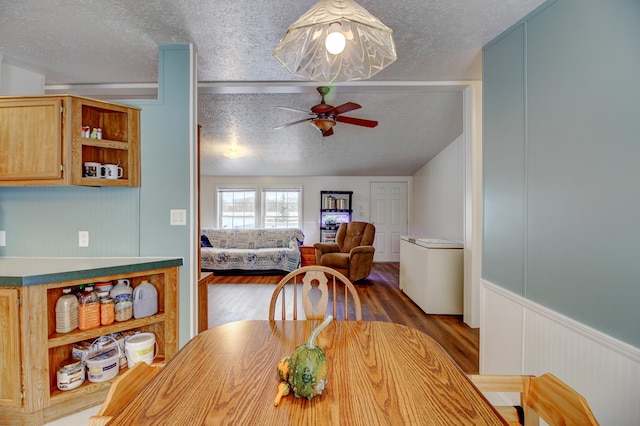 15331 129th Ave, Wadena, MN 56482 - dining space featuring a textured ceiling, wood finished floors, and ceiling fan