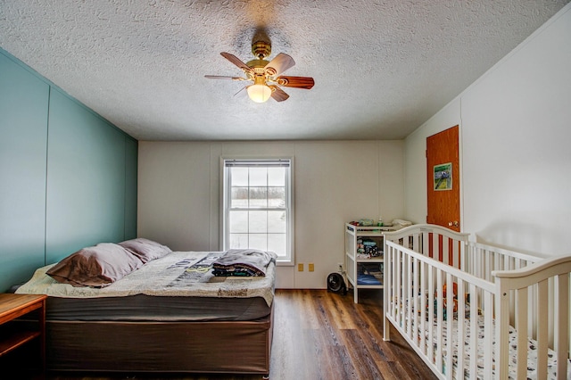 15331 129th Ave, Wadena, MN 56482 - bedroom with wood finished floors, a ceiling fan, and a textured ceiling