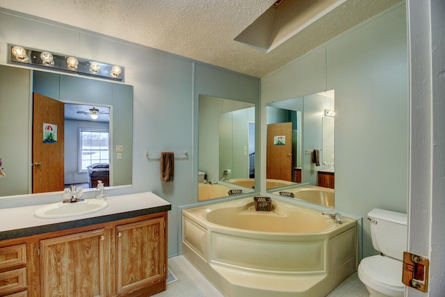 15331 129th Ave, Wadena, MN 56482 - bathroom featuring toilet, a textured ceiling, a garden tub, vanity, and ceiling fan