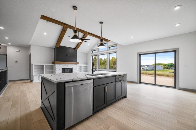 kitchen featuring light stone countertops, dishwasher, ceiling fan, vaulted ceiling with beams, and a center island with sink