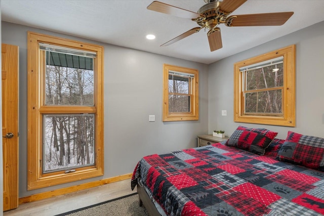 bedroom featuring ceiling fan and light wood-type flooring