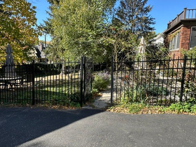 view of gate featuring fence