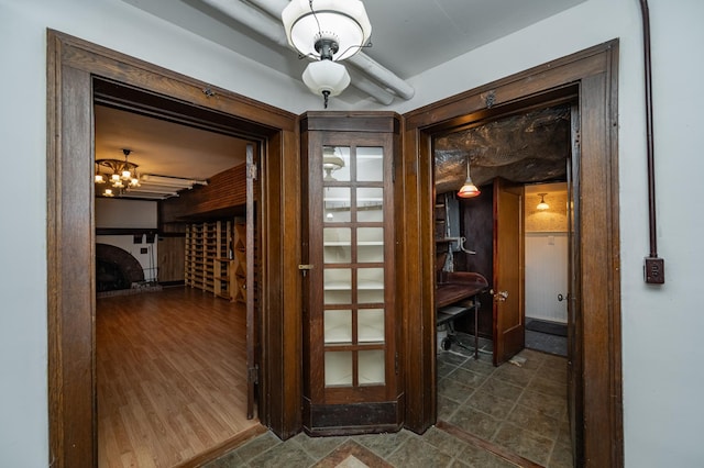 hall featuring an inviting chandelier