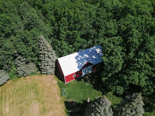 drone / aerial view featuring a view of trees