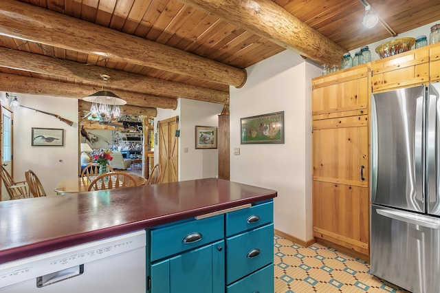 kitchen with blue cabinetry, white dishwasher, freestanding refrigerator, wood ceiling, and dark countertops