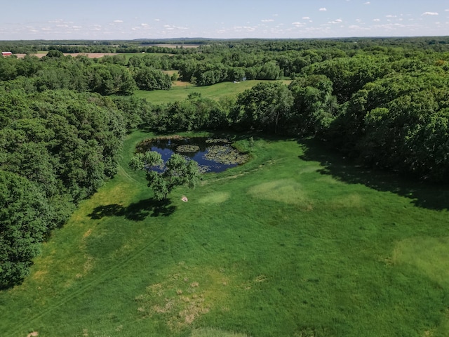 birds eye view of property with a wooded view