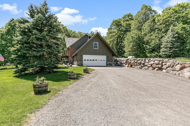 view of home's exterior with aphalt driveway, a lawn, and stone siding