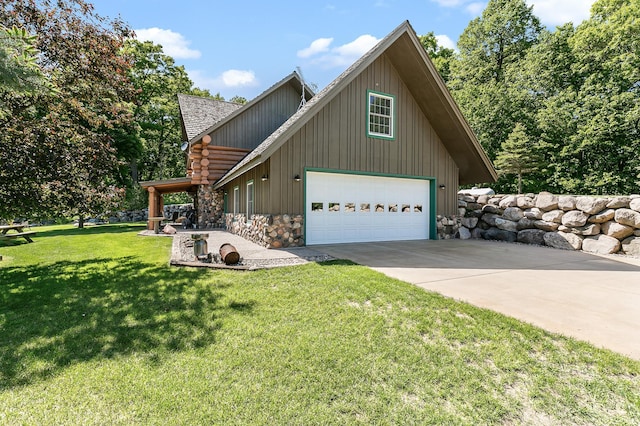 view of side of property featuring concrete driveway, a garage, a lawn, and stone siding