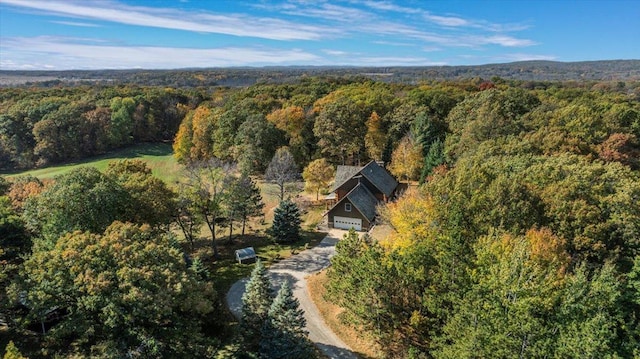 drone / aerial view featuring a forest view