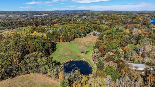 birds eye view of property with a wooded view