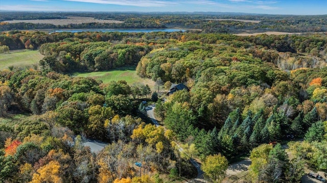 bird's eye view with a forest view and a water view