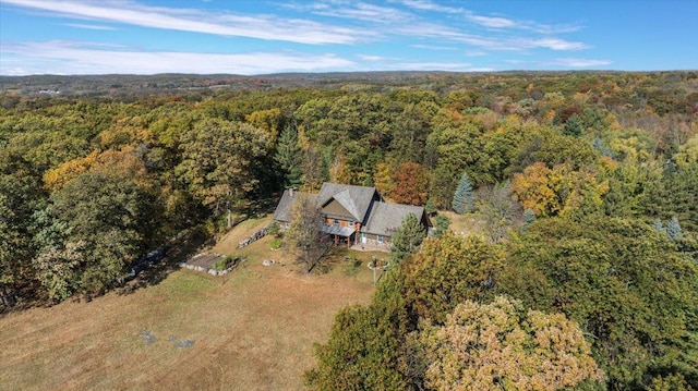 aerial view featuring a wooded view