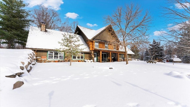 view of snow covered house