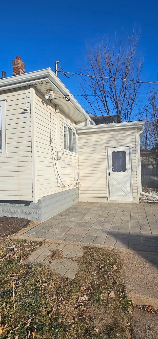 view of property exterior with a patio