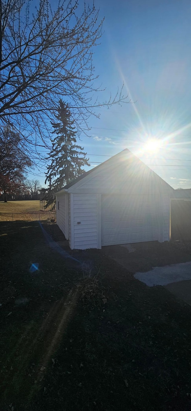 exterior space featuring a garage and an outdoor structure