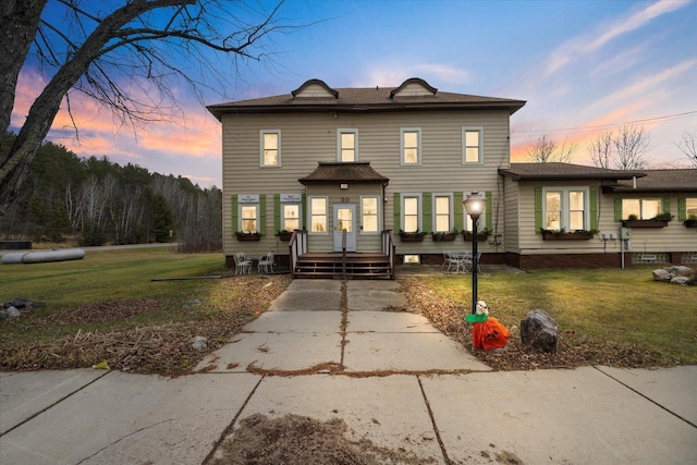 front facade featuring a yard