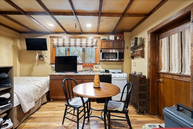 dining space with light hardwood / wood-style floors