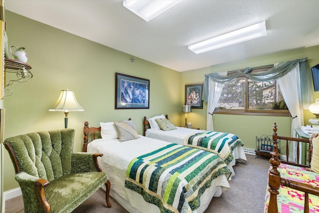 bedroom featuring carpet flooring and a textured ceiling