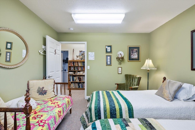 carpeted bedroom featuring a textured ceiling