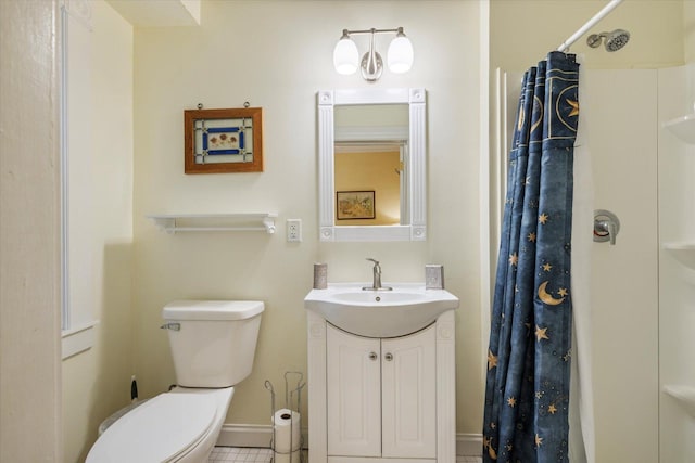 bathroom featuring tile patterned floors, vanity, curtained shower, and toilet