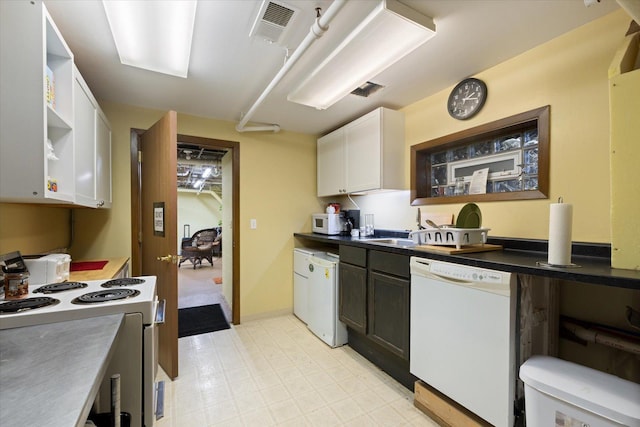 kitchen with white cabinets and white appliances