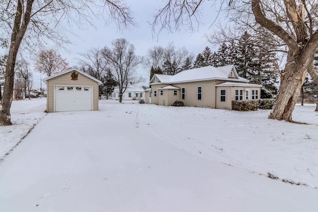 exterior space featuring an outbuilding and a garage