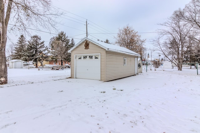 view of snow covered garage