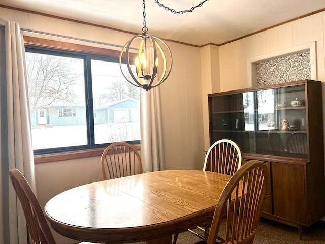 dining room featuring crown molding and an inviting chandelier