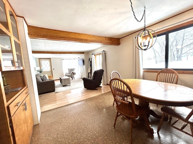 dining area featuring beamed ceiling, wood-type flooring, and an inviting chandelier