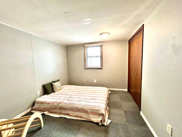 carpeted bedroom featuring a closet