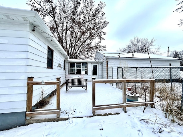 view of snow covered deck