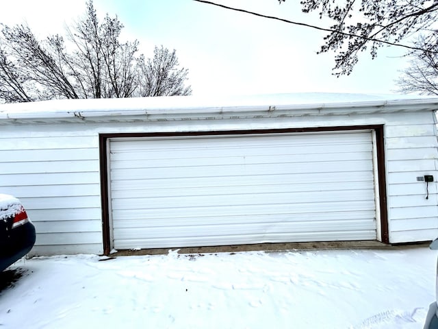 view of snow covered garage