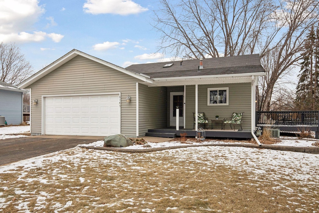 view of front of house with a garage and covered porch