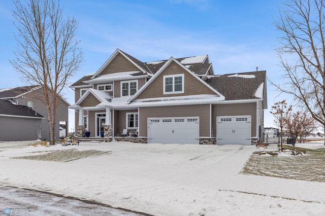 craftsman-style home featuring a porch and a garage