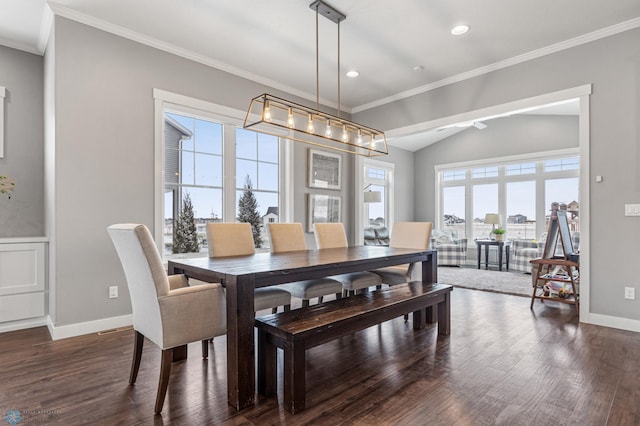 dining area featuring crown molding, dark hardwood / wood-style flooring, and vaulted ceiling