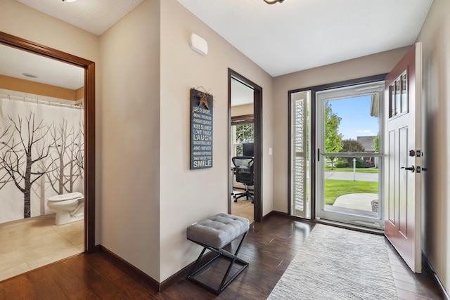 entryway with dark wood-type flooring