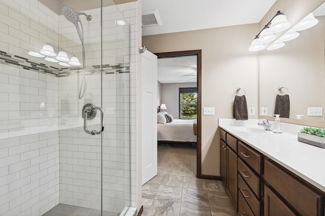 bathroom with an enclosed shower and vanity