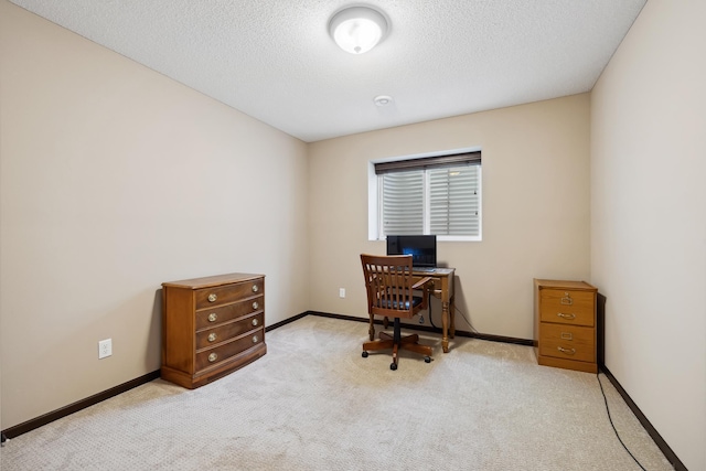 carpeted office with a textured ceiling