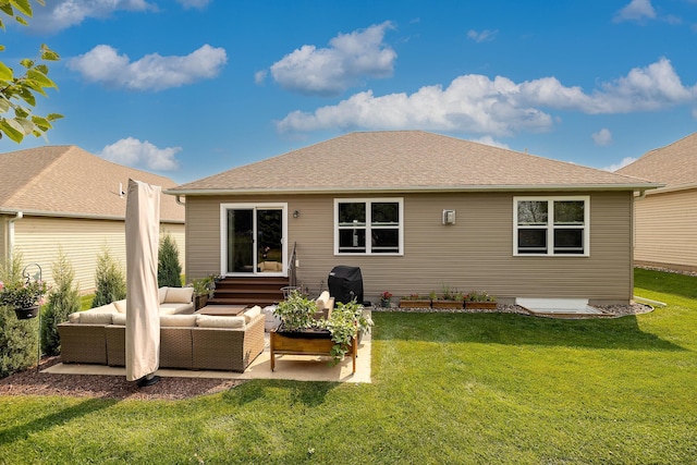 rear view of property featuring outdoor lounge area and a lawn