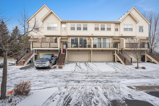 townhome / multi-family property featuring a garage