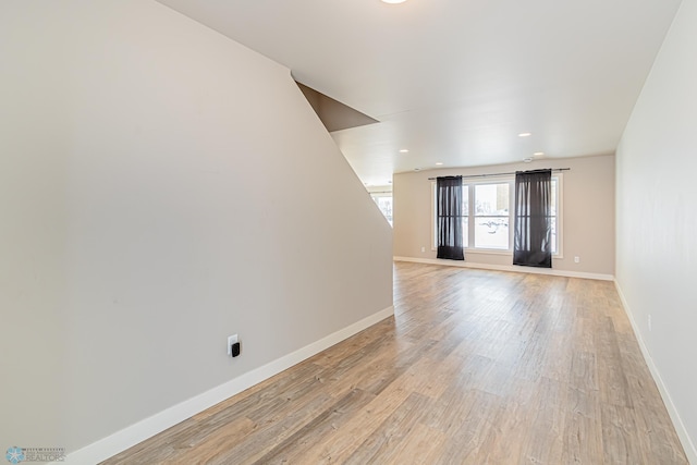 unfurnished room with light wood-type flooring