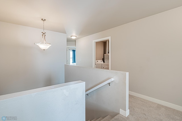 interior space featuring washing machine and dryer and carpet floors